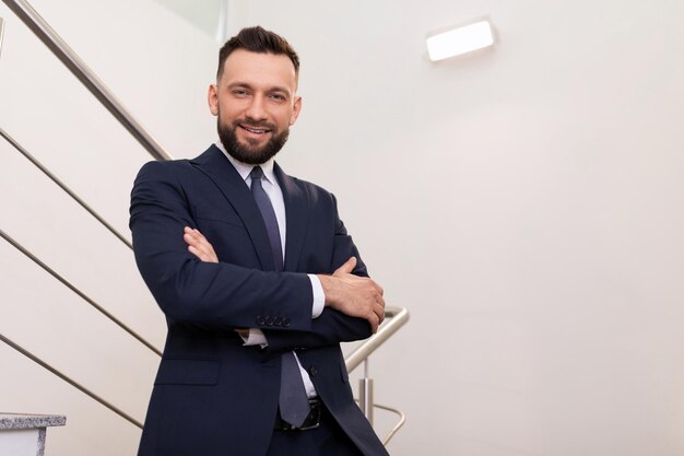 Photo portrait of a middleaged business man with crossed arms on his chest top manager concept