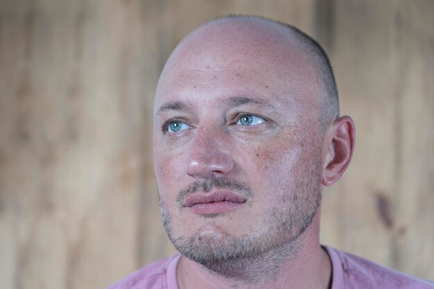 Portrait of middleaged caucasian bald man close up