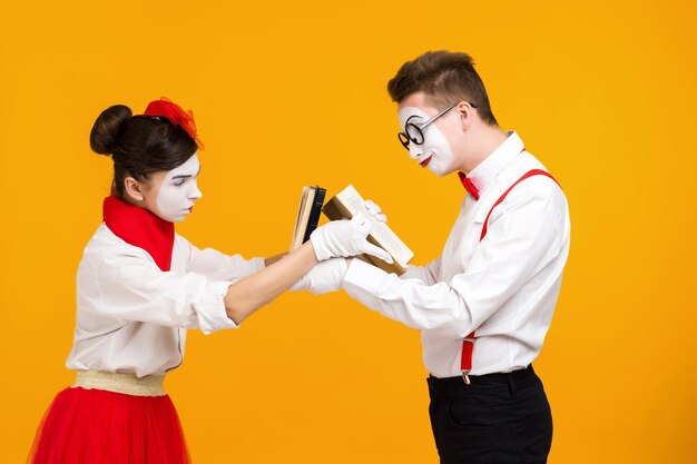 Portrait of mime couple artist with book