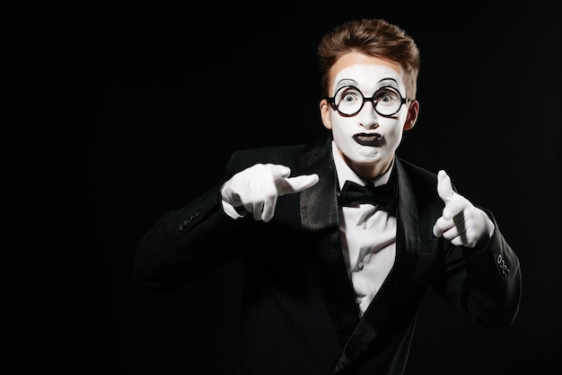 Portrait of mime man on black background