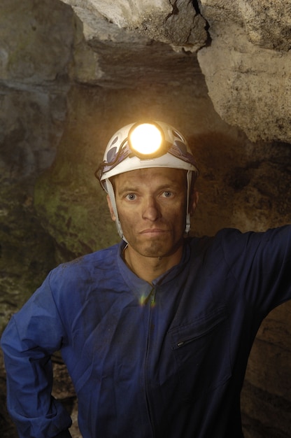 Portrait of a miner inside a mine