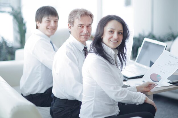 Portrait of modern business woman on the background of her workplace