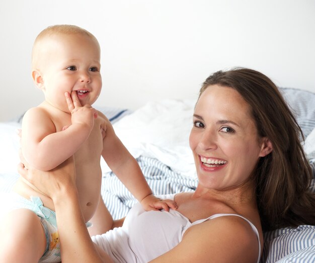 Portrait of a mother and baby laughing together