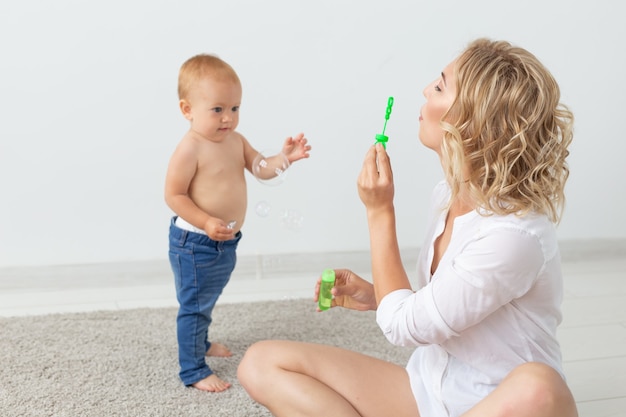 Portrait of mother and baby playing and smiling at home