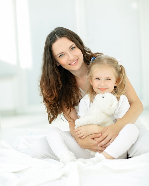 Portrait of mother and beloved little daughter