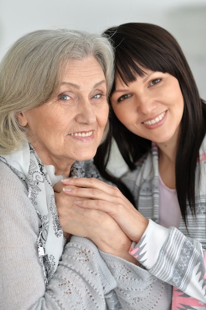 Portrait of mother and daughter, close up