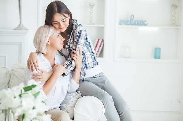 Portrait of mother and daughter at home