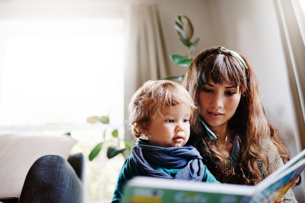 portrait of mother and daughter sitting at home