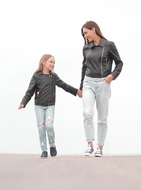 Portrait of a mother and daughter walking together