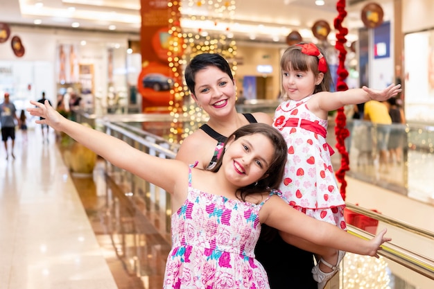 Portrait of mother and daughters at the mall