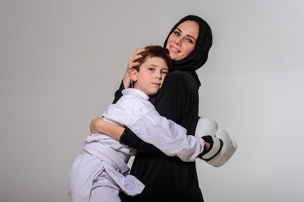 Portrait of mother and her champion boxer son