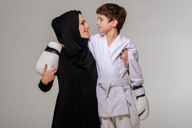 Portrait of mother and her champion boxer son