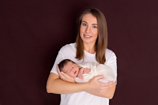 portrait of a mother holding her baby