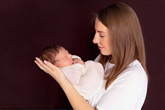 portrait of a mother holding her baby