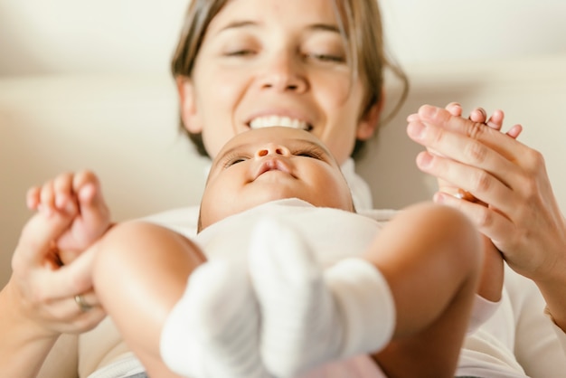 Portrait of a mother with her baby at home.