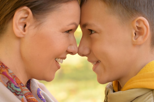 Portrait of mother with son in autumnal park