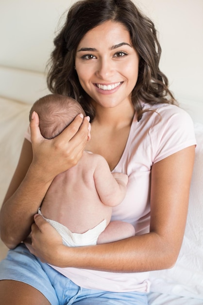 Photo portrait of mother with son sitting on sofa at home