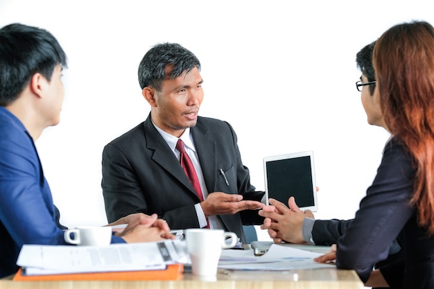 Portrait Of Multiracial Businesspeople Brainstorming In Meeting