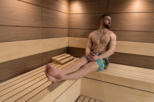 Portrait Of A Muscular Man Relaxing In Sauna