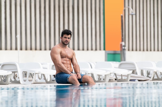 Portrait Of A Muscular Man At Swimming Pool