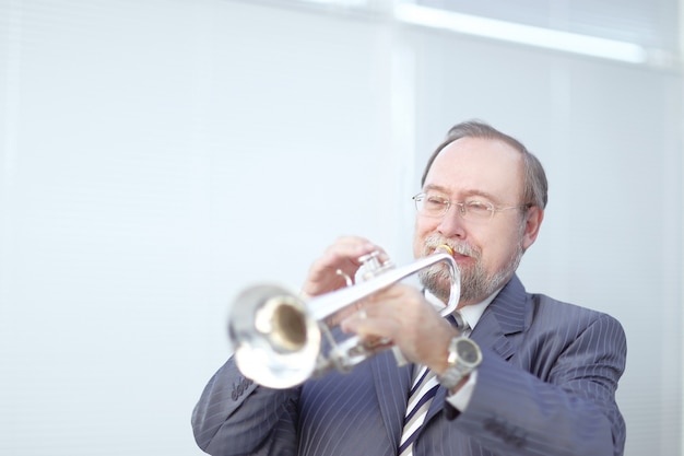 Portrait of a musician playing the trumpet.