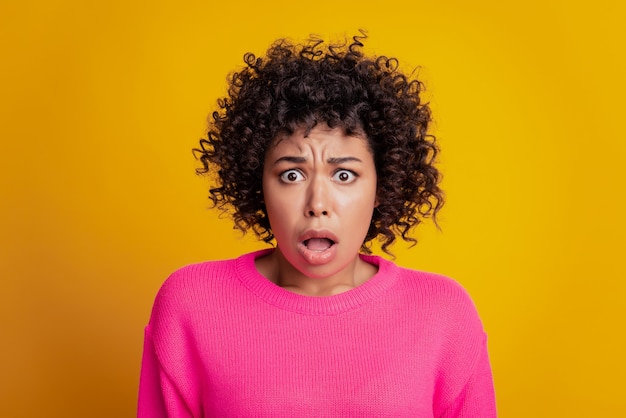 Portrait of negative nervous sad girl open mouth look camera on yellow wall