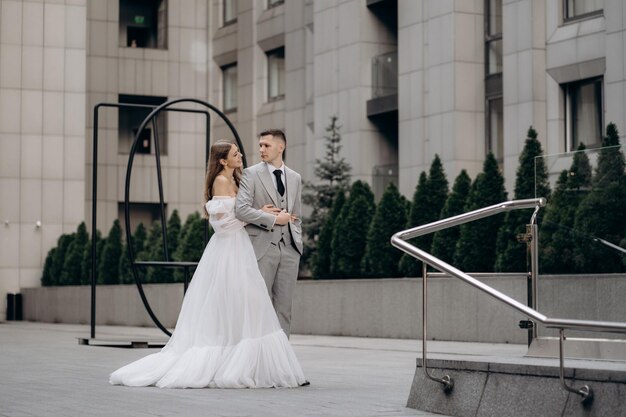 Portrait of a newly married couple bride smiling hugging groom concept of love and happiness