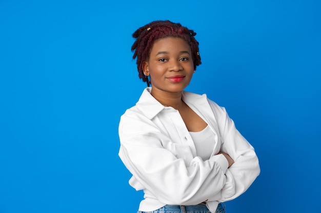 Portrait of nice attractive african american woman against blue background