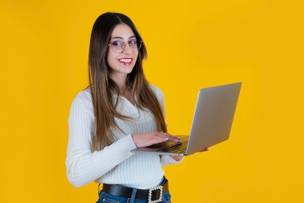 Portrait of nice attractive caucasian woman holding laptop young beautiful businesswoman