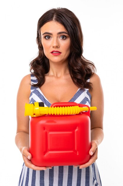 Portrait of nice caucasian girl holds a phone and credit card isolated on white