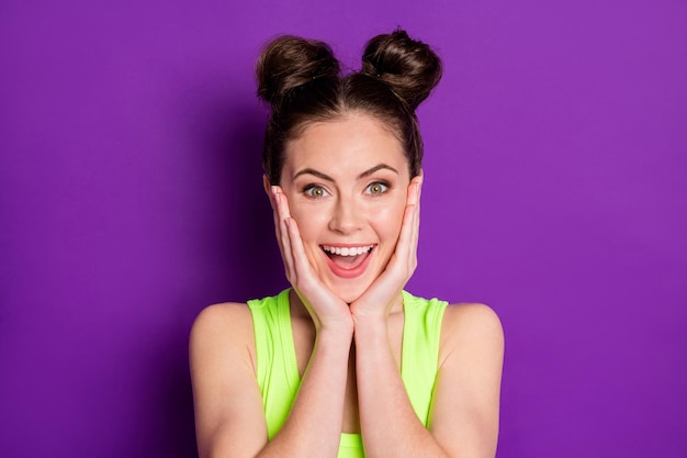 Portrait of nice girl touch hands face impressed wear look good tank top isolated over bright color background