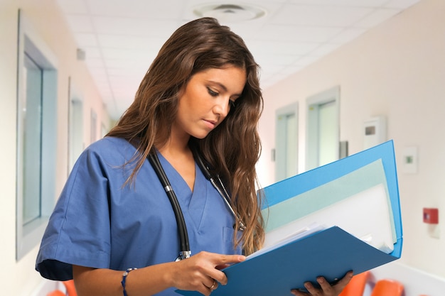 Portrait of a nurse reading a document