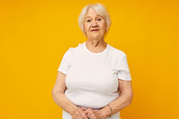 Portrait of an old friendly woman happy lifestyle joy isolated background