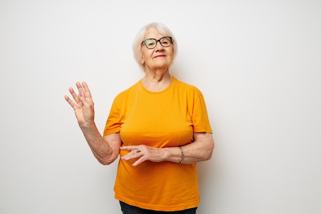 Portrait of an old friendly woman health lifestyle eyeglasses treatment isolated background