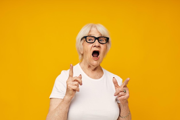 Portrait of an old friendly woman vision problems with glasses isolated background