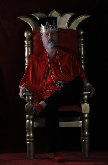 portrait of an old king on the throne