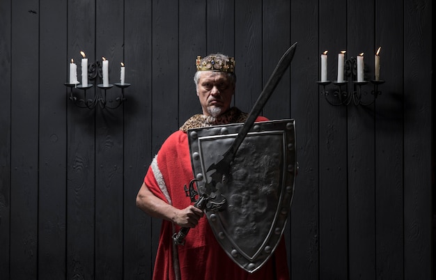 portrait of the old medieval king by candlelight