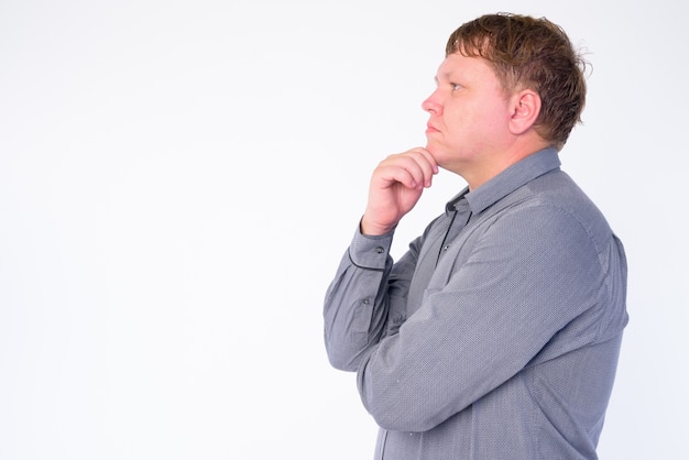 Portrait of overweight businessman isolated on white