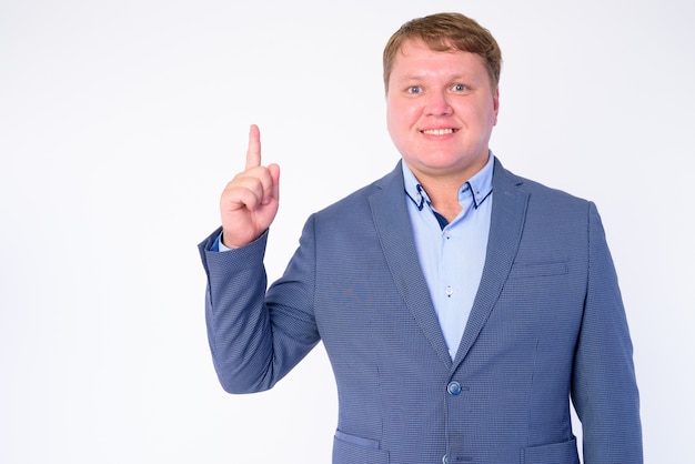 portrait of overweight businessman wearing suit isolated on white