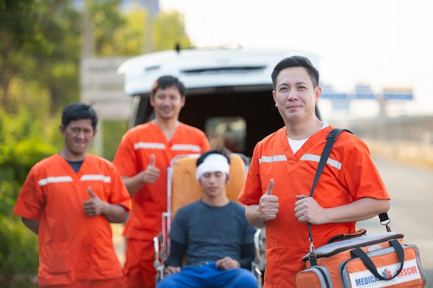 Portrait of paramedic team is assisting an injured man in an emergency situation on the road