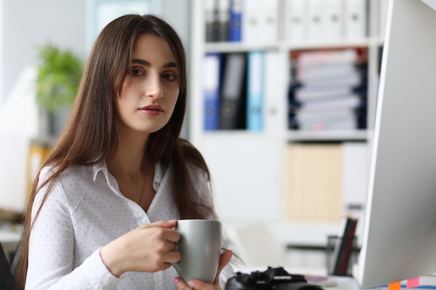 Portrait of peaceful woman designing interest project. Beautiful businesswoman