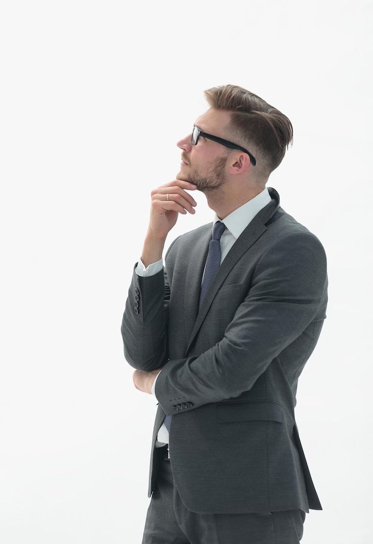 Photo portrait of a pensive businessman looking away isolated on a white background