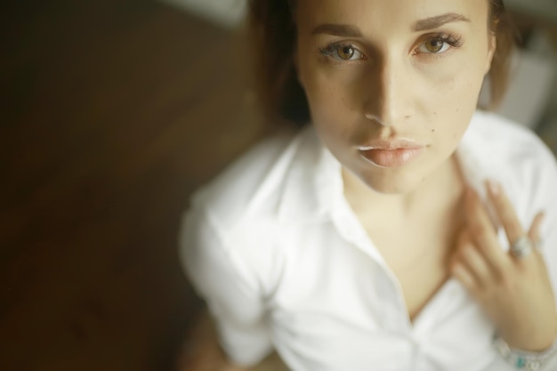 Photo portrait of a pensive young adult beautiful girl