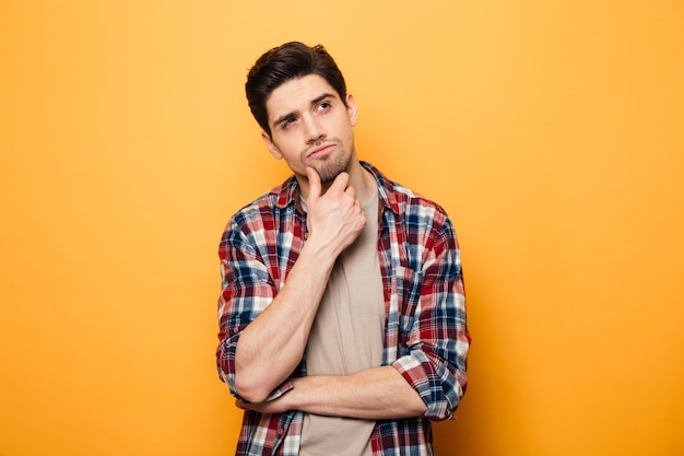 Portrait of a pensive young man looking away