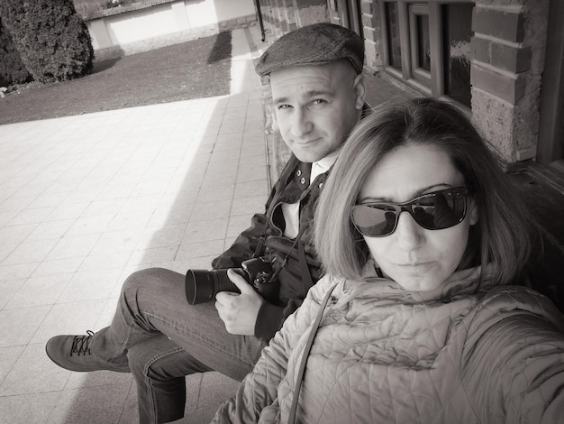 Portrait of people sitting outdoors