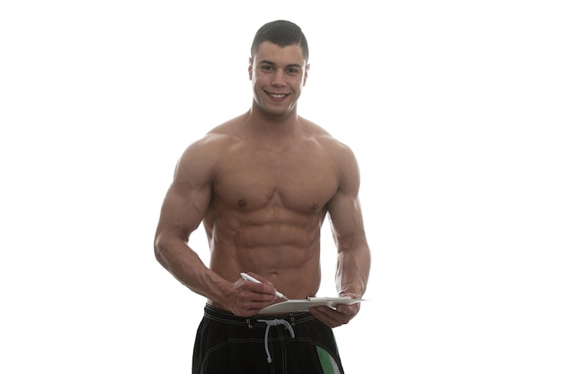 Portrait Of A Personal Trainer With Clipboards In His Hands Over White Background