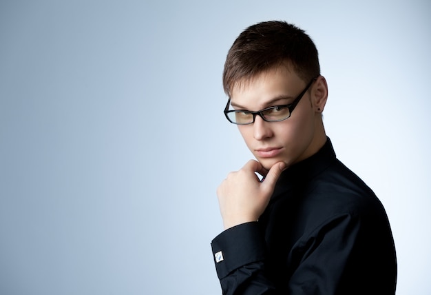 Portrait photo guy in black shirt and glasses