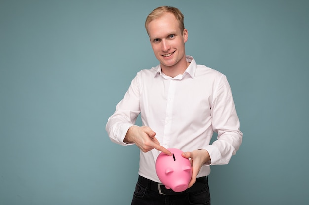 Portrait photo of happy positive smiling young handsome blond man with sincere emotions wearing