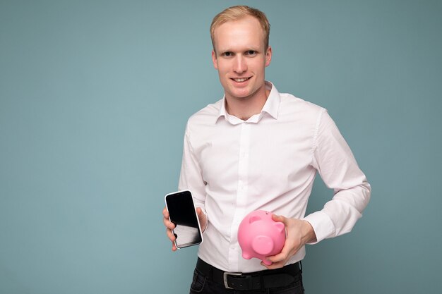 Portrait photo of happy positive smiling young handsome blond man with sincere emotions wearing