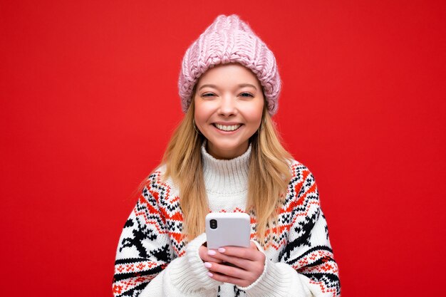 portrait Photo shot of attractive positive good looking young woman wearing casual stylish outfit